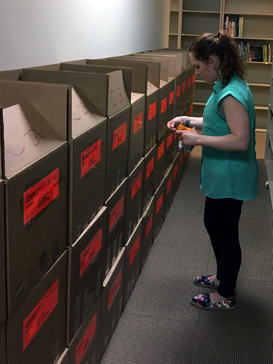 ALSC awards intern Corinne Demyanovich prepares the 2017 Bookapalooza award for shipment. Photo courtesy of ALSC.