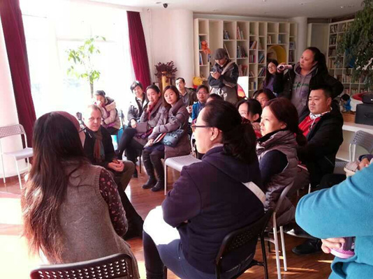 Participants in an early-morning storytime and parental Q&A listen to Echo Liu, owner of Beijing’s Baby Cube Library and children’s publishing house, respond to one of the author’s points.