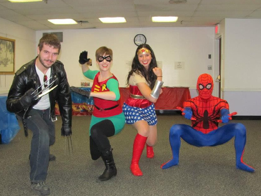 The original band of heroes from FCBD 2.0 (2014) with author and librarian Molly Virello second from the right dressed as Wonder Woman