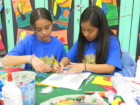 Grades 3–5: Dasha and Mariana work on bookmaking (all photos by Diane Vozza).
