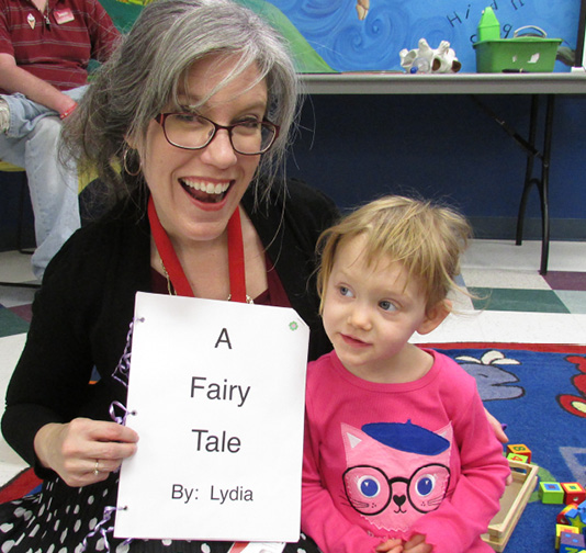 Librarian Laura Raphael and her little literary friend Lydia.