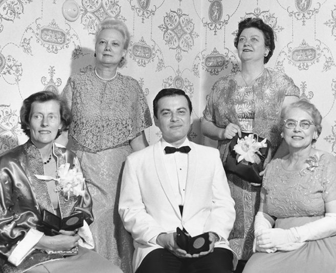 Pictured in this 1964 photo are, from left, Emily Neville, winner of the Newbery Medal; Maurice Sendak, winner of the Caldecott Medal; and Ruth Gagliardo, President of the Children’s Services Division. Standing left to right: Helen Sattley, chair of the Newbery-Caldecott Awards Committee and Ursula Nordstrom, juvenile editor of Harper & Row, publisher of both the winning books.