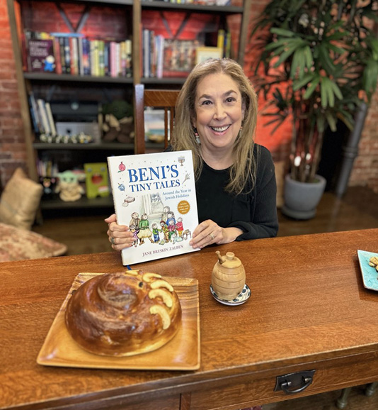 Jane Breskin Zalen holding her book Beni's Tiny Tales. Photo courtesy of Julie Gribble, KidLit TV.