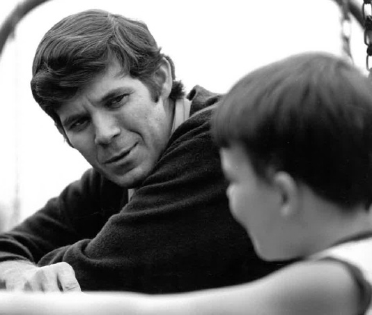 Dr. Robert Clapp, Laura (Clapp) Raphaels father, interacts with a child as part of his role as clinical psychologist for the Children's Medical Center in 1974. (Check out those sideburns!) He was always a patient listener, gardening our thoughts and emotions.