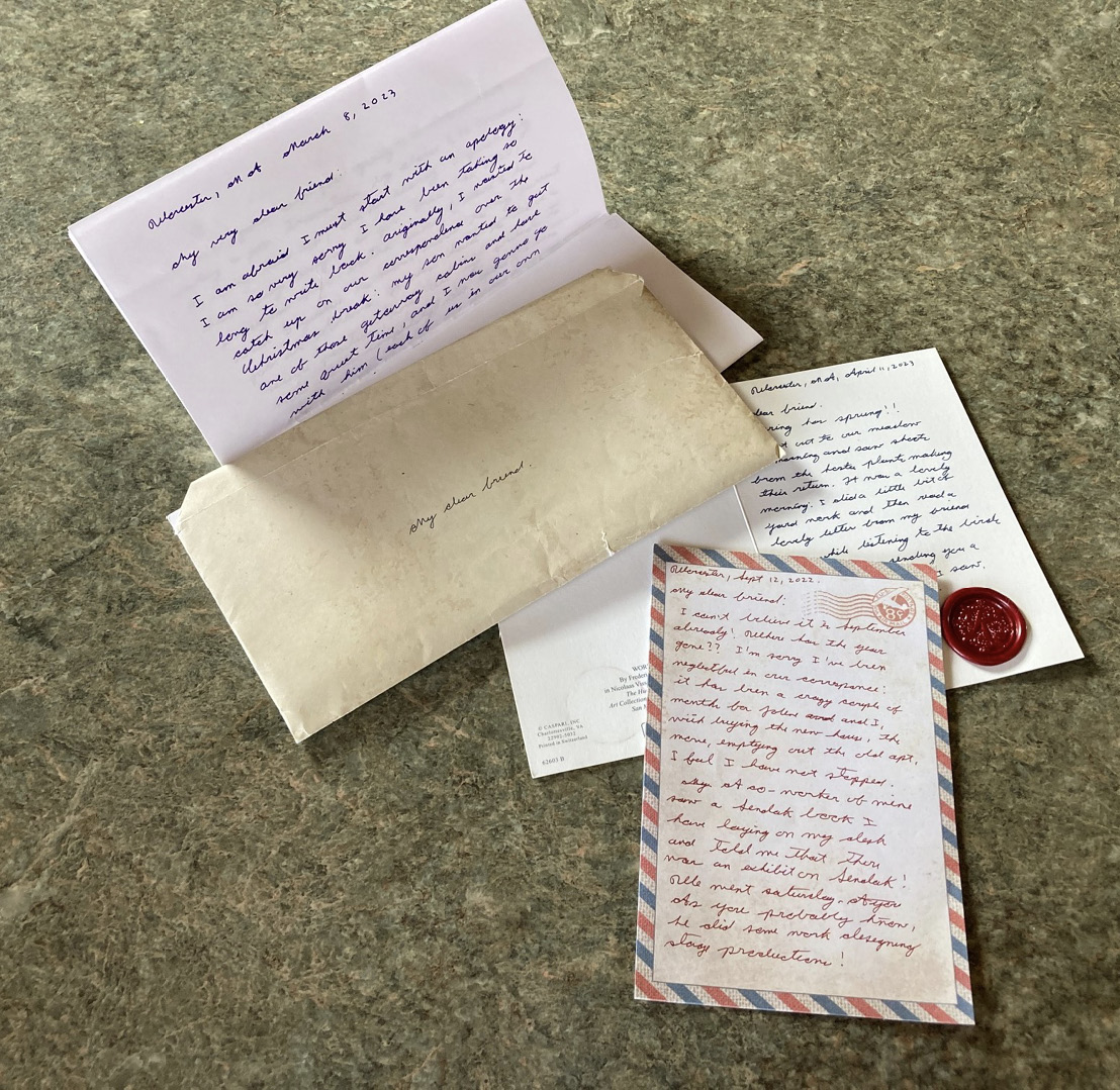 A multi-page letter and two postcards, all hand-written.