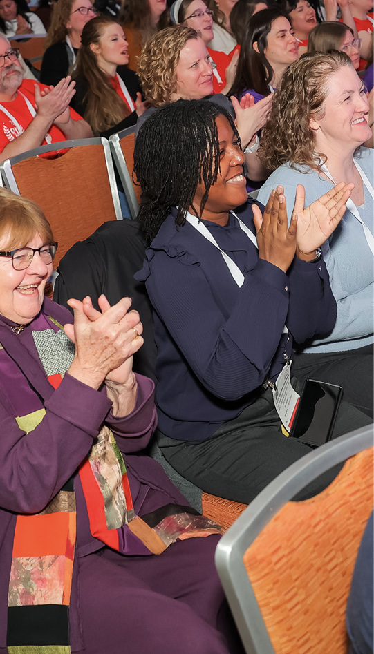 Members of the Legacy committee applaud as their 2024 Legacy Award winner—Pam Muñoz Ryan—is announced.